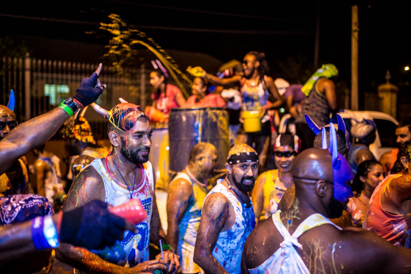 Splashing paint J’ouvert morning with Dirty Dozen. Photo Credit: UK Soca Scene